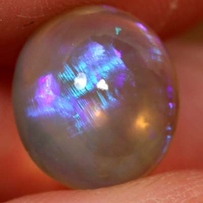 SOLID CRYSTAL OPAL Large opal with bright blue and purple rolling flashes